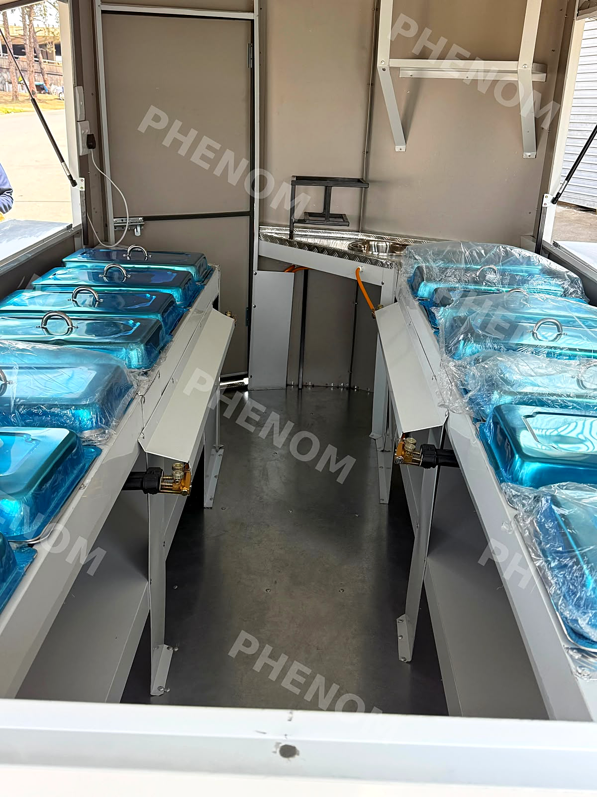 Rows of steam food warmers fitted inside a trailer